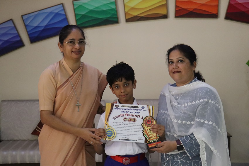 MEDAL AND A TROPHY IN PUNJABI HANDWRITING AND DANCE COMPETITION